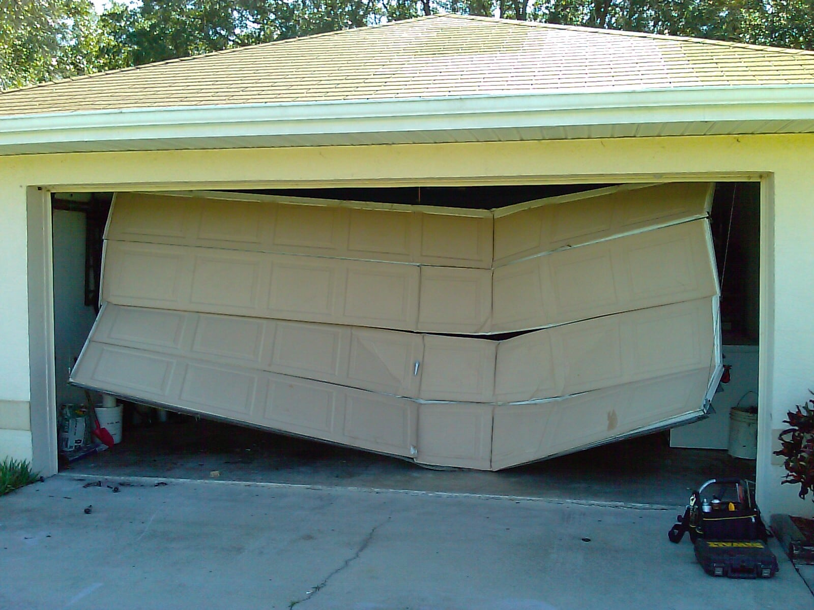 Auto impacted garage door